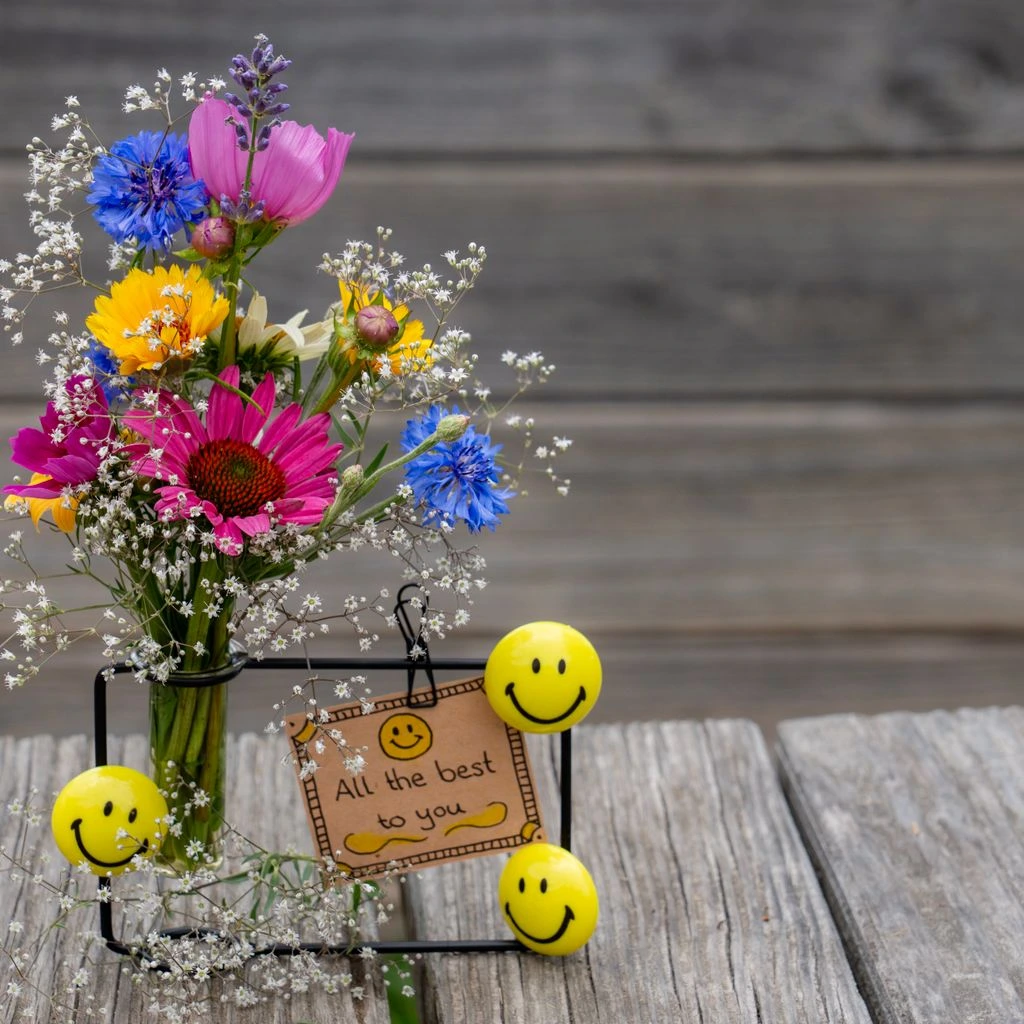 A cheerful yellow tulip get-well bouquet in a glass jar